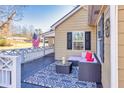 Relaxing front porch with seating area and American flag at 405 Tanner Rd, Dacula, GA 30019