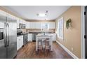 Modern kitchen with stainless steel appliances and island at 405 Tanner Rd, Dacula, GA 30019