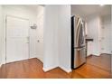 Entry foyer with hardwood floors and access to the kitchen at 3334 Peachtree Ne Rd # 908, Atlanta, GA 30326