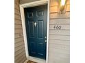 Front door of the condo unit with a dark blue door and house number 460 at , Roswell, GA 30076