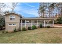 Tan house with carport and landscaping at 3435 Misty Valley Rd, Decatur, GA 30032