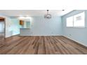 Bright dining area with light blue walls and wood-look floors at 4251 Hamilton Mill Rd, Buford, GA 30519