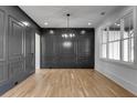 Elegant dining room boasts dark gray walls and hardwood floors at 1254 Prospect Rd, Lawrenceville, GA 30043