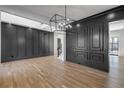Open concept dining room with hardwood floors and gray wall accents at 1254 Prospect Rd, Lawrenceville, GA 30043