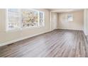Bright living room featuring wood-look floors and large windows at 1786 Ledo Ave, Decatur, GA 30035