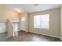 Living room with hardwood floors and access to upper level at 3972 Glenwood Downs Ln, Decatur, GA 30035