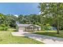 Inviting one-story residence with an attached garage and spacious driveway at 6226 Pine Ln, Douglasville, GA 30135