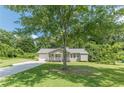 Quaint single-story home nestled among trees with a welcoming front porch at 6226 Pine Ln, Douglasville, GA 30135