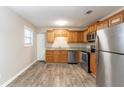 Updated kitchen with stainless steel appliances and granite countertops at 8661 Chestnut Ln, Lithia Springs, GA 30122