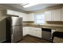 Modern kitchen with stainless steel appliances and granite countertops at 4731 Kings Hwy, Douglasville, GA 30135