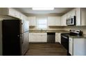 Modern kitchen with stainless steel appliances and granite countertops at 4731 Kings Hwy, Douglasville, GA 30135