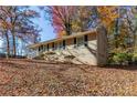 Tan brick ranch home with a covered carport and steps leading to the front door at 2329 Meadowlane Sw Dr, Atlanta, GA 30311