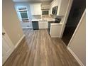 Renovated kitchen with new appliances and flooring at 4887 Glenwood Rd, Decatur, GA 30035