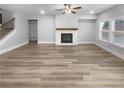 Spacious living room featuring hardwood floors and a fireplace at 422 Mcdaniel Pl, Canton, GA 30115
