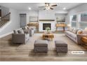 Virtually staged living room with fireplace, hardwood floors, and neutral decor at 422 Mcdaniel Pl, Canton, GA 30115