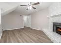 Living room with fireplace, hardwood floors, and neutral walls at 100 Spicewood Ct, South Fulton, GA 30349