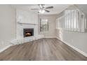 Living room with fireplace, hardwood floors, and neutral walls at 100 Spicewood Ct, South Fulton, GA 30349