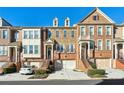Three-story brick townhouses with attached garages at 5012 Ridgemont Se Walk # 19, Atlanta, GA 30339