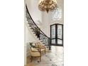 Grand entry with curved staircase, chandelier, and ornate double doors at 6206 Zell Miller Nw Path, Acworth, GA 30101