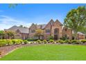 Stunning brick home with beautiful landscaping and a large lawn at 6206 Zell Miller Nw Path, Acworth, GA 30101