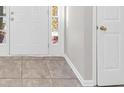Front entry with tile flooring and neutral-colored walls at 116 Rolling Meadows Ct, Hampton, GA 30228