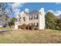 Two-story house with a brick facade, attached garage, and landscaping at 116 Rolling Meadows Ct, Hampton, GA 30228