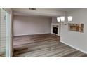 Open concept dining area with hardwood floors and a view of the living room at 2683 Meadowlawn Se Dr, Marietta, GA 30067