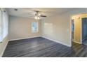 Bright bedroom with dark gray vinyl flooring and ceiling fan at 329 Mount Zion Sw Rd, Atlanta, GA 30354