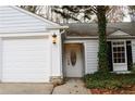 White exterior, front door entry, landscaping at 2688 Crystal Ln, Lawrenceville, GA 30044