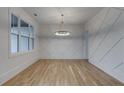 Elegant dining room featuring hardwood floors and a statement wall at 1258 Prospect Rd, Lawrenceville, GA 30043