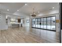 Open concept Gathering room with hardwood floors, fireplace and pool view at 1258 Prospect Rd, Lawrenceville, GA 30043