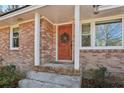 Inviting wood front door entrance with wreath at 2051 Sheffield Rd, Conyers, GA 30012