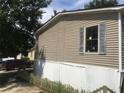 Tan mobile home with white skirting at 815 Dogwood Trl, Jonesboro, GA 30238