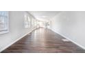 Open concept living area with hardwood floors at 3686 Thurman Rd, Atlanta, GA 30349