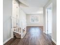 Bright living room with hardwood floors and staircase at 3686 Thurman Rd, Atlanta, GA 30349