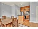 Modern kitchen with wood cabinets and stainless steel appliances at 57 Forsyth Nw St # 4D, Atlanta, GA 30303