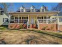 Two-story house featuring a wrap around porch at 1060 River Cove Rd, Social Circle, GA 30025