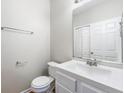 Small bathroom with white vanity, toilet and mirrored medicine cabinet at 2020 Austin Park Cir, Decatur, GA 30032