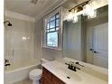 Bathroom with tub, single vanity, and updated lighting at 208 Serendipity Way, Dallas, GA 30157