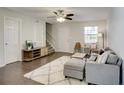 Living area features hardwood floors, neutral decor, and ample light at 3149 Buford Ne Hwy # 7, Atlanta, GA 30329