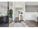 Bright entry hall with hardwood floors, view of dining room and staircase at 316 Rodeo Dr, Auburn, GA 30011