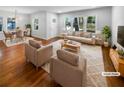 Virtually staged living room featuring hardwood floors and ample natural light at 2861 Sylvan Rd, Atlanta, GA 30344