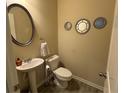 Clean powder room with pedestal sink and decorative mirrors at 3885 Nixon Grove Dr, Douglasville, GA 30135