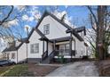Two-story house with a white exterior, gray accents, and a spacious front yard at 576 Rockwell Sw St, Atlanta, GA 30310