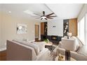 Modern living room with a fireplace, hardwood floors, and stylish furniture at 2191 Essex Sw Ave, Atlanta, GA 30311