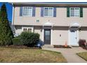 Two-story townhome with neutral siding, landscaping, and two front doors at 1625 Conley Rd # 229, Conley, GA 30288