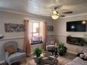 Living room with comfy seating, decorative accents and a fireplace at 1625 Conley Rd # 229, Conley, GA 30288
