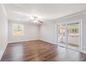 Spacious living room featuring hardwood floors and sliding glass doors at 2307 Cresta Dr, Decatur, GA 30032