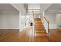 Bright and spacious two story foyer with hardwood floors and staircase at 7250 Weber St, Atlanta, GA 30349
