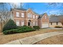 Two-story brick home with a large front yard and mature trees at 7250 Weber St, Atlanta, GA 30349